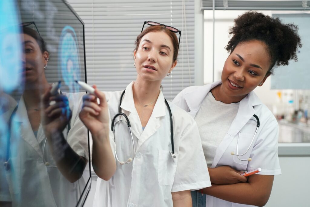 Group of doctors looking at X ray on medical conference, discussing issues